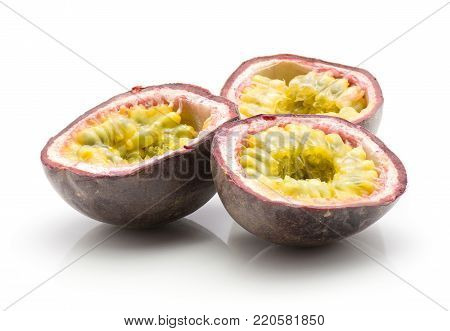 Three passion fruit halves isolated on white background