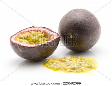 Passion fruit one whole one half with flesh isolated on white background