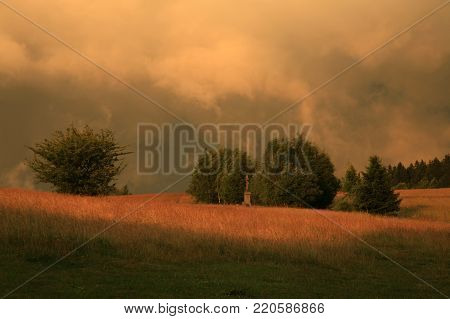 Dramatic sky with big clouds above Pasterka village in Table Mountain in Poland. Stormy weather, natural armagedon.