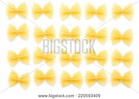 Raw farfalle top view isolated on white background twenty dry pasta pieces folded in square