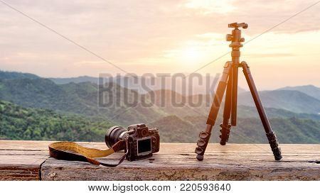 Travel photographer equipment with beautiful landscape on the background, Traveling and Relax Concept.