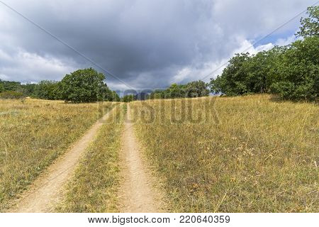 A dirt road on the pass of the Tokluk ridge. Crimea, September.