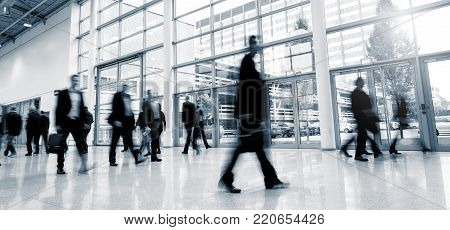 crowd of business people rushing in a modern hall. ideal for websites and magazines layouts