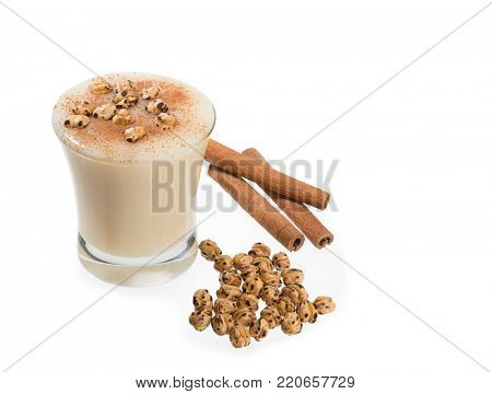 Traditional Turkish drink called Boza with cinnamon sticks and chick-pea.   