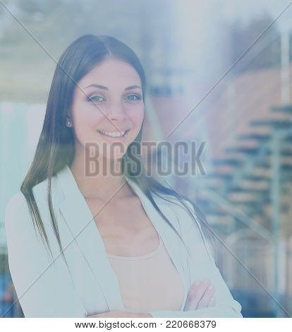 business woman looking thtough window in the office