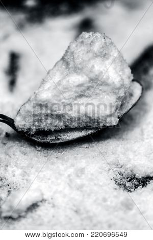 Common Salt,sodium Chloride In A Wooden Scoop On Wooden Floor.