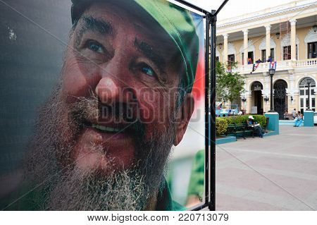 SANTAGO DE CUBA, CUBA  - 01 DECEMBER 2016: Exhibition of photographs from the life of Fidel organised after his death, on the main square Santiago, presenting moments from the life of the dictator