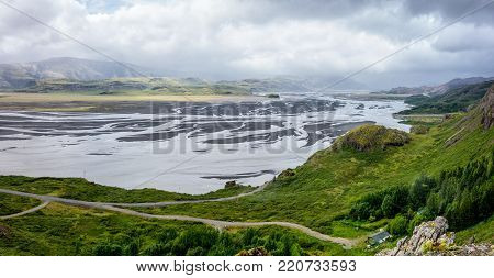 Wide angle panorama of Jokulsa i Loni river in Iceland, Europe in cloudy weather