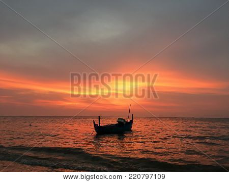 Beautiful sunset beach on a fishing boat