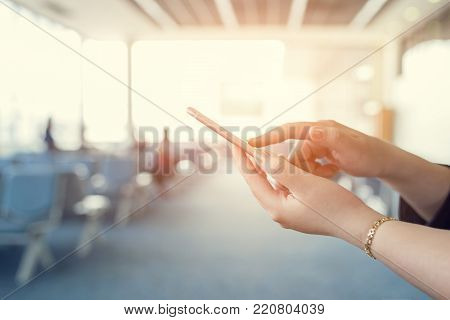 Woman use of cellphone inside waiting room