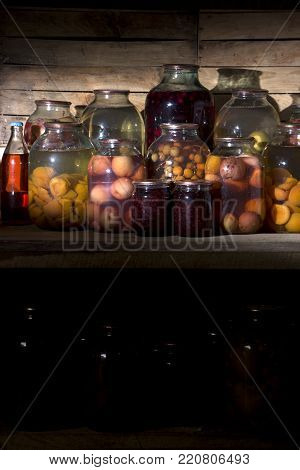 home preservation in a dark cellar in which breaks through several rays of light close up