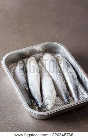 Frozen Sardines. Cornish. For Grill And Bbg. Dark Background.