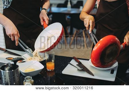 Culinary Master Class For Cooking Pasta With Mussels. Close-up Of Hands