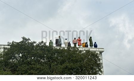 Lubeck, Germany - 07 26 2015 - Figures On The Roof Of Music And Congress Centre