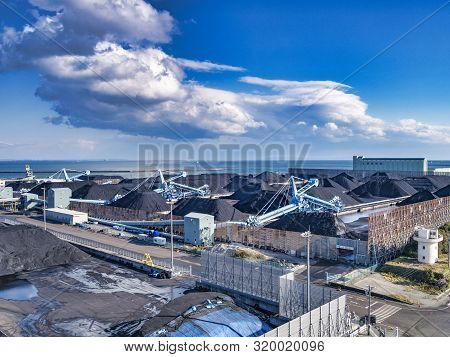 2 April 2019: Yokkaichi Port, Japan - Imported Coal And Loading Equipment At Chubu Coal Centre, On A