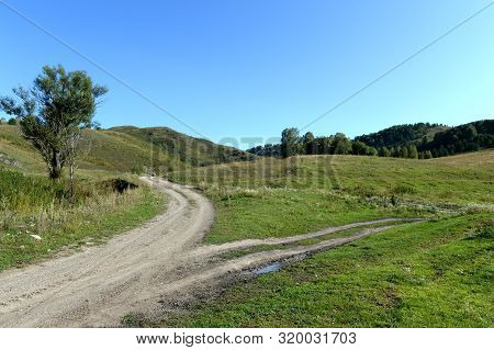 Field Road In The Vicinity Of The Taiga Village Of Generalka Altai Region. Western Siberia