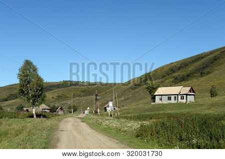 Taiga Village Generalka In The Mountains Of The Altai Territory.western Siberia. Russia