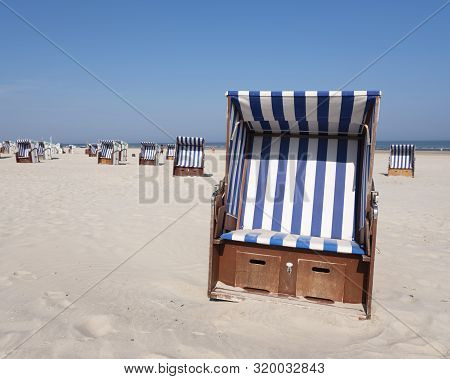 Beach Korbs On The Island Of Norderney In Germany Off The Coast Of East Frieland On Sunny Day In Aug