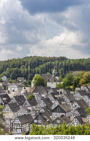 White Half Timbered Houses Of The Historic Town Freudenberg, Germany