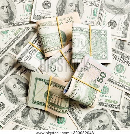 Us Dollar Bills Bundles Stack. One Hundred Dollar Bills With Stack Of Money In The Middle. Top View 