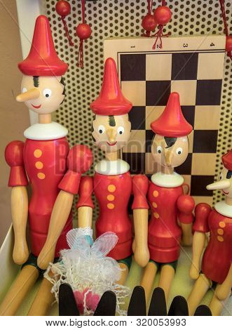 Sorrento, Italy - June 12, 2017: Painted Wooden Marionette Dolls Of The Figure Of Pinocchio  In A So