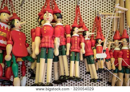 Sorrento, Italy - June 12, 2017: Painted Wooden Marionette Dolls Of The Figure Of Pinocchio  In A So