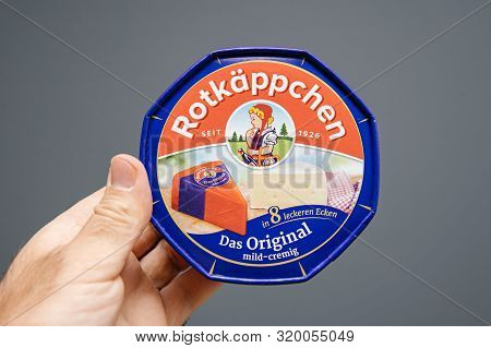 Paris, France - Aug 30, 2019: Man Hand Holding Rotkappchen Das Original Mild-cremig German Cheese Re