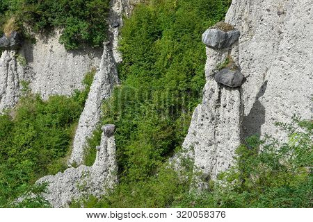 Monument Rocks (chalk Pyramids) Of Zone At Lake Iseo In Italy