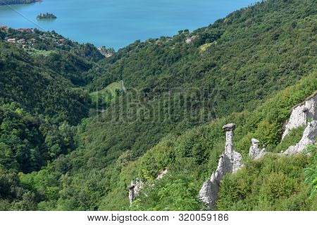 Monument Rocks (chalk Pyramids) Of Zone At Lake Iseo In Italy