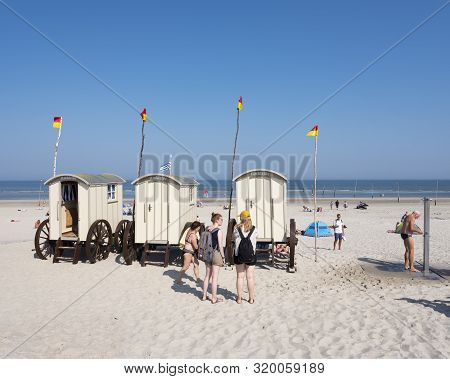 Norderney, Germany, 25 August 2019: Old Fashioned Bathing Carts Used For Changing On Sunny Beach Of 