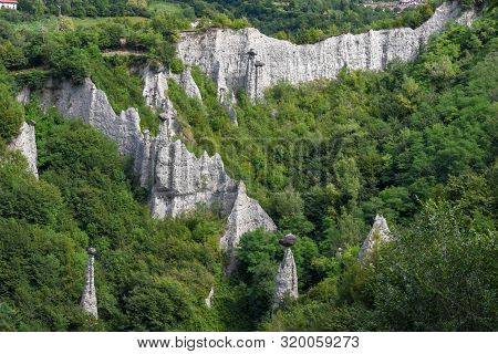 Monument Rocks (chalk Pyramids) Of Zone At Lake Iseo In Italy