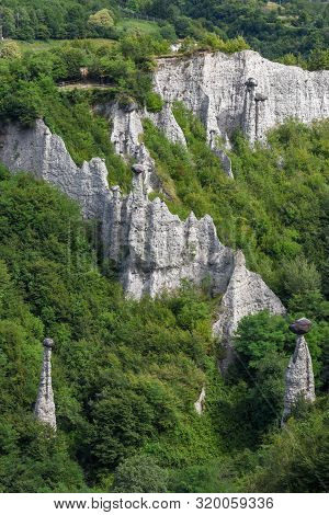 Monument Rocks (chalk Pyramids) Of Zone At Lake Iseo In Italy
