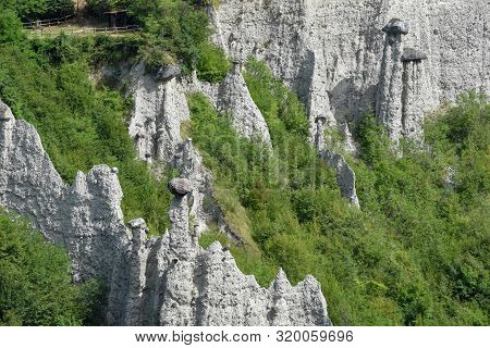 Monument Rocks (chalk Pyramids) Of Zone At Lake Iseo In Italy