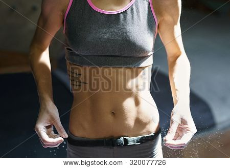 Athletic Muscular Woman With Muscular Naked Torso Getting Ready To Climbing. Woman Hands In White Ch