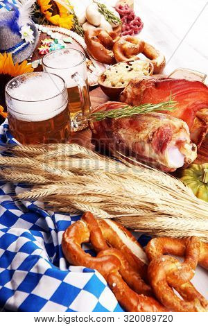Traditional German Cuisine, Schweinshaxe Roasted Ham Hock. Beer, Pretzels And Various Bavarian Speci