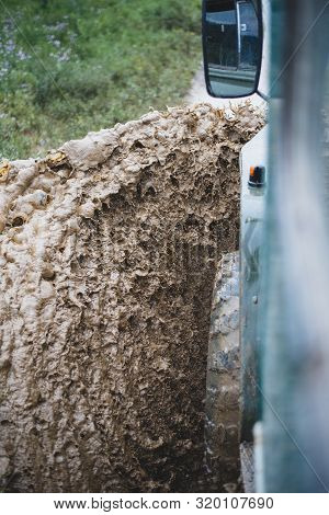 A Stream Of Dirt Flies Off The Wheel