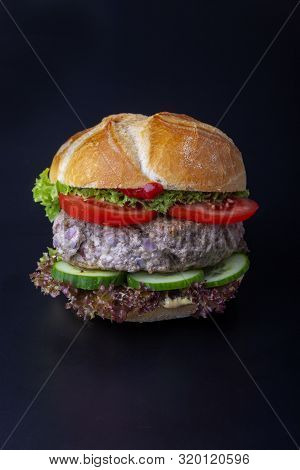 Bavarian Burger In A Typical Bun On Black