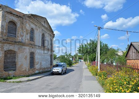 Village Street And Ruins Of Synagogue In Stolin, Belarus.