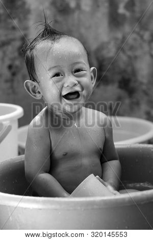 Cute Little Baby Enjoying His Morning Bath