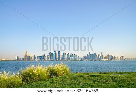 Al Dafna Or Doha Business District Commercial Skyline Across Doha Harbor From Green Grassy Area Near
