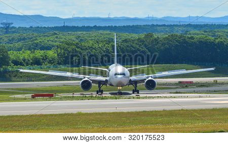 Sapporo, Japan - Jul 3, 2019. Passenger Airplane Taxiing On Runway Of New Chitose Airport (cts) In S