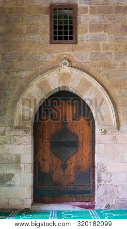 Cairo, Egypt- January 23 2016: Vaulted Closed Decorated Wooden Grunge Door In Bricks Stone Wall At P