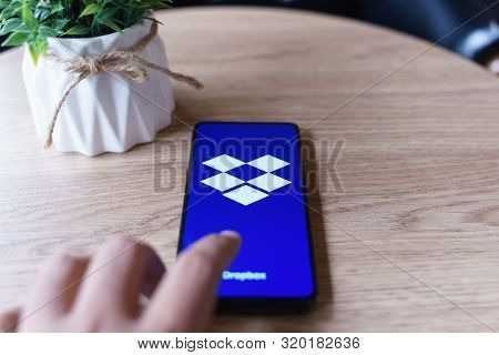 Chiang Mai, Thailand - Aug.24,2019: Man Holding Xiaomi Mi Mix 3 With Dropbox On Screen. Dropbox Is A