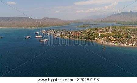 Aerial View Ferry Port Gilimanuk With Ferry Boats, Vehicles. Ferries Transport Vehicles And Passenge