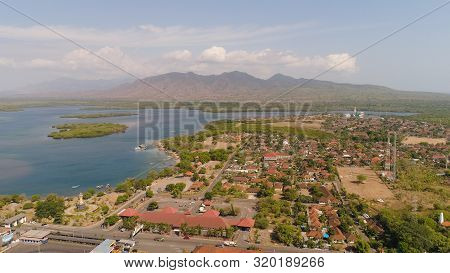 Aerial View Ferry Port Gilimanuk With Ferry Boats, Vehicles. Ferries Transport Vehicles And Passenge
