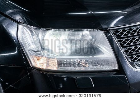 Novosibirsk, Russia - August 19, 2019:  Suzuki Grand Vitara, Black Car Headlights. Exterior Detail. 