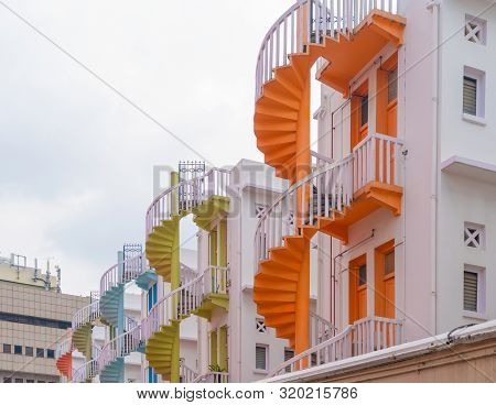 Close Up Of Colorful Pastel Spiral Staircases In Singapore, Bugis Village, Vintage Style Fire Exit O