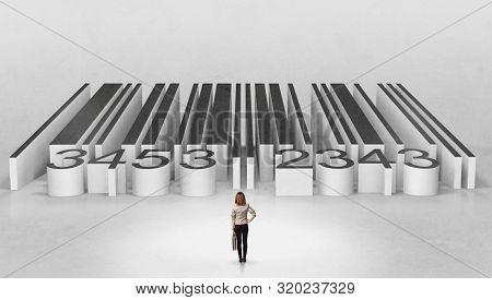 Young businessman standing in front of a big codebar