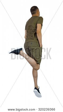 Back view of man in zero gravity or a fall. guy is flying, falling or floating in the air. Side view people collection. side view of person. Isolated over white. The guy in sneakers jumped high.