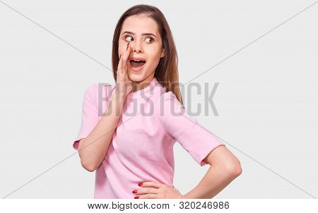 Amazed Beautiful Young Woman Looking At The Camera With Surprised Expression. Surprised Female, Hold